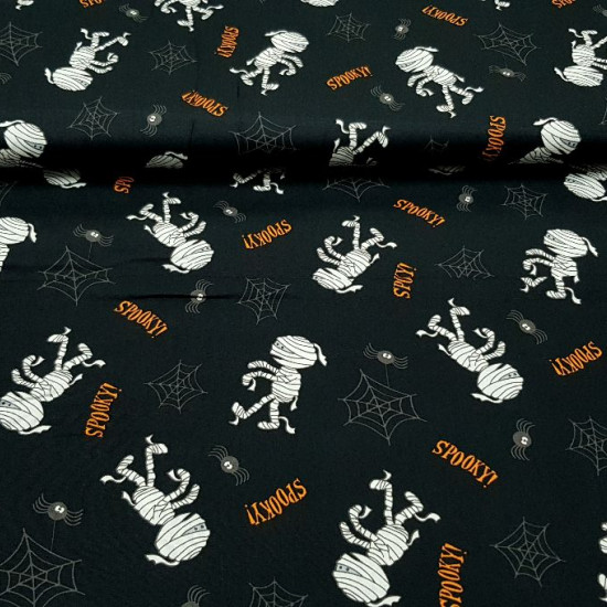 Cotton Halloween Mummies Spiders fabric Cotton Halloween Mummies Spiders fabric - Halloween-themed cotton fabric, with drawings of mummies, spiders and cobwebs on a black background. The fabric is 140cm wide and its composition 100% cotton.